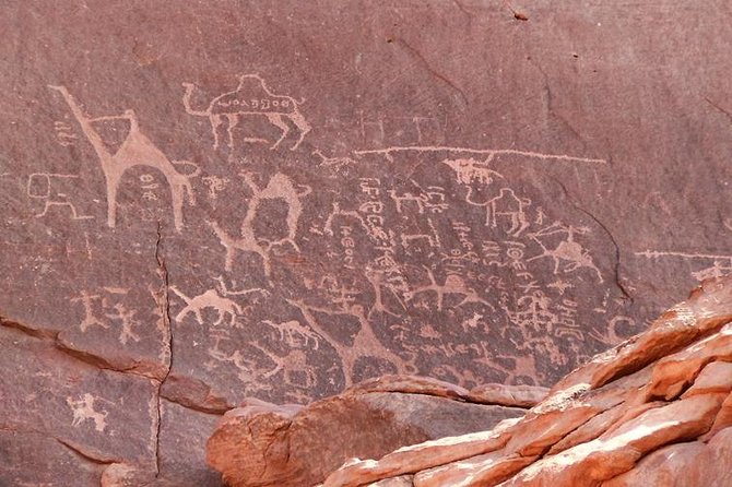 Ancient inscriptions carved into rock at Wadi Rum